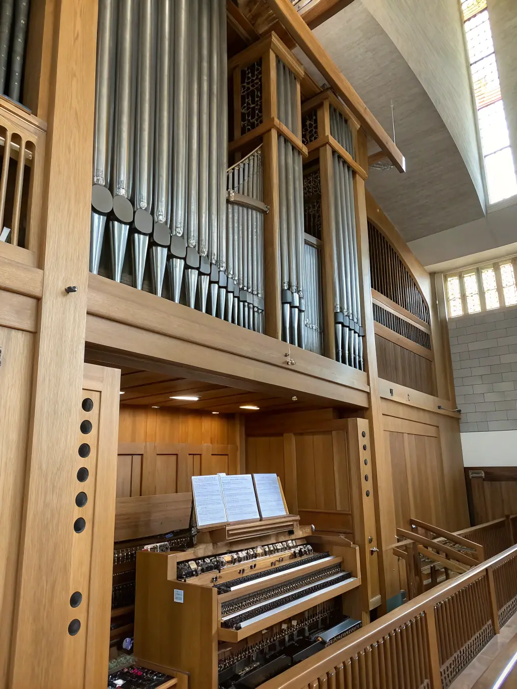 A photograph of the Église de Recoules' historical organ, showcasing its intricate design and craftsmanship, with a focus on its musical significance.